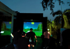 Playing Golf Simulator on open terrace